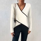 Women's white V-neck sweater with comfortable fitted cut and timeless style