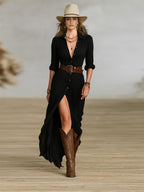 Women's long belted dress with pleated lapels and waist-defining adjustable belt