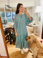 Women's green maxi boho dress with V-neckline and geometric print, flowy ankle-length