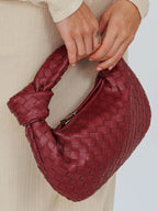 Women woven mini handbag in burgundy with button handle detail