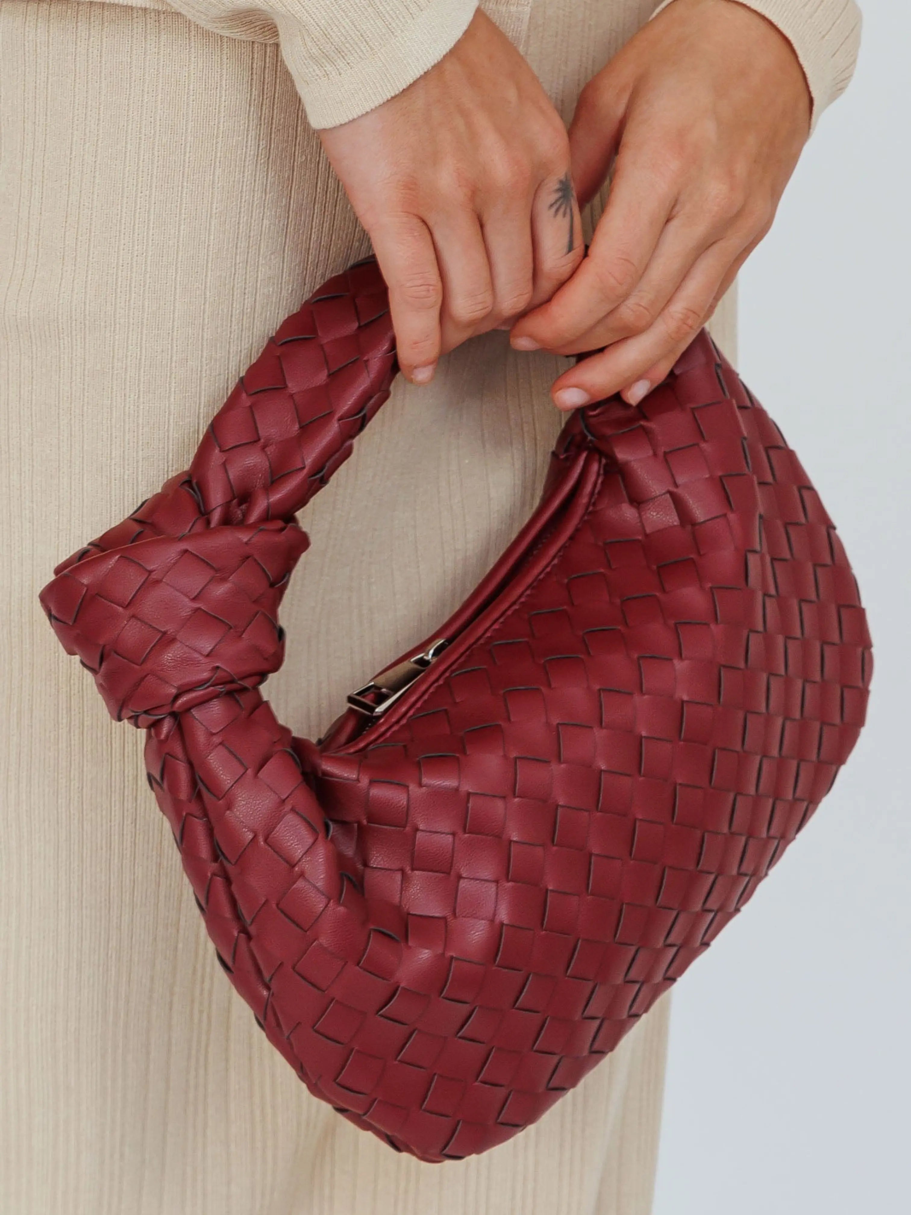 Women woven mini handbag in burgundy with button handle detail