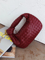 Women woven mini handbag in burgundy with button handle detail