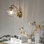 Wall lamp curved arm spherical ribbed glass shade gold finish modern indoor