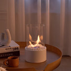 Decorative ethanol oil lamp with metal frame, glass cylinder, and decorative stones, indoor and outdoor