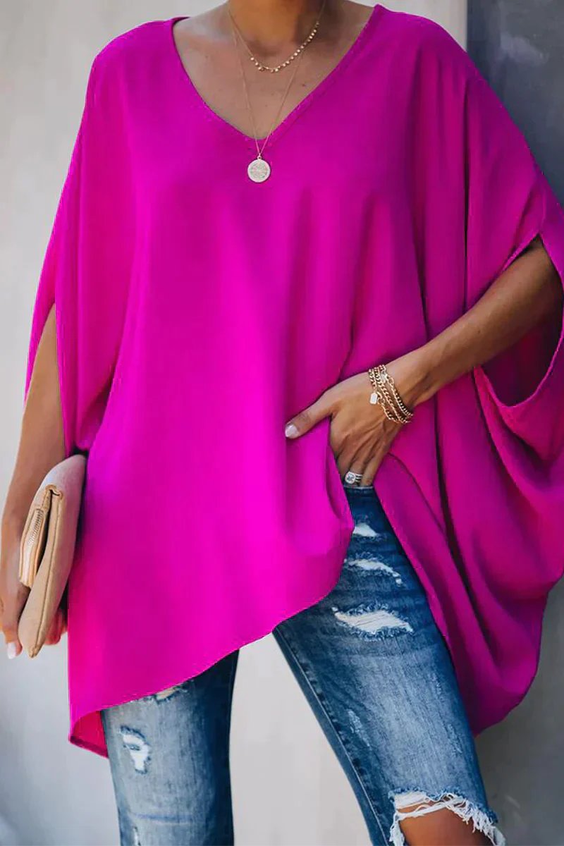 Women oversized tunic top with batwing sleeves and V-neckline, asymmetric hem