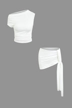 Women's two-piece set with one-shoulder top and draped mini skirt, asymmetric knot detail