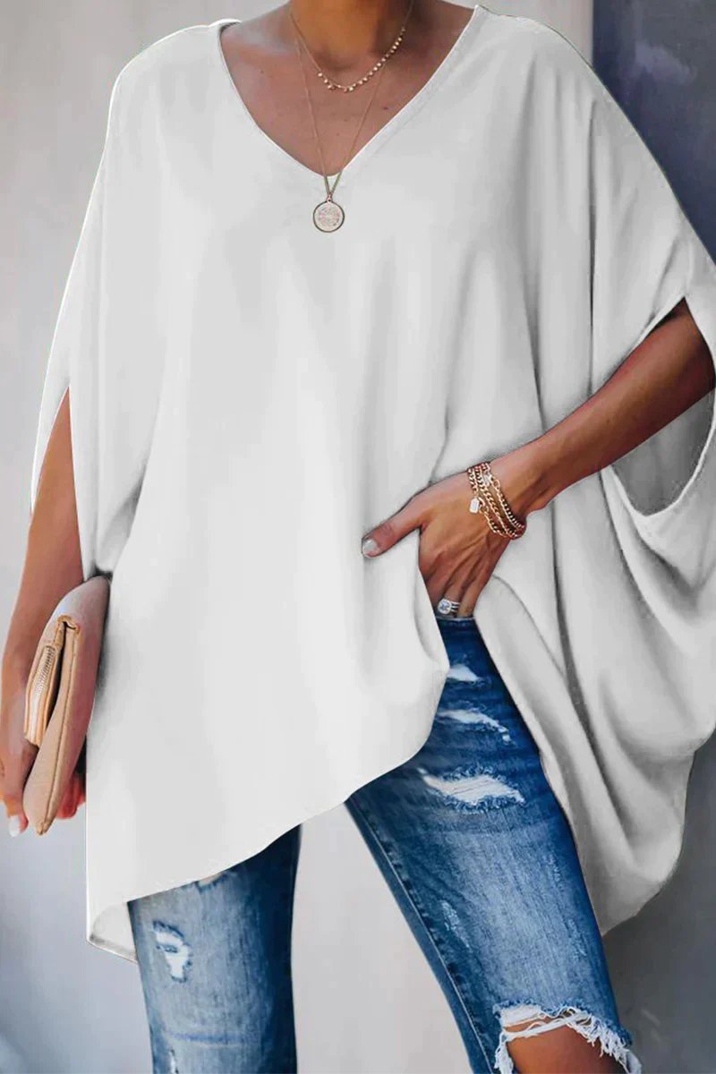 Women oversized tunic top with batwing sleeves and V-neckline, asymmetric hem