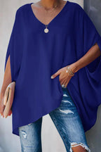 Women oversized tunic top with batwing sleeves and V-neckline, asymmetric hem