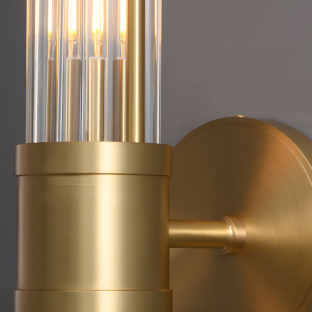 Modern wall lamp with cylindrical ribbed clear glass shade in chrome or gold finish