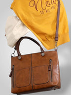 Women leather shoulder bag with magnetic snap closure and adjustable strap
