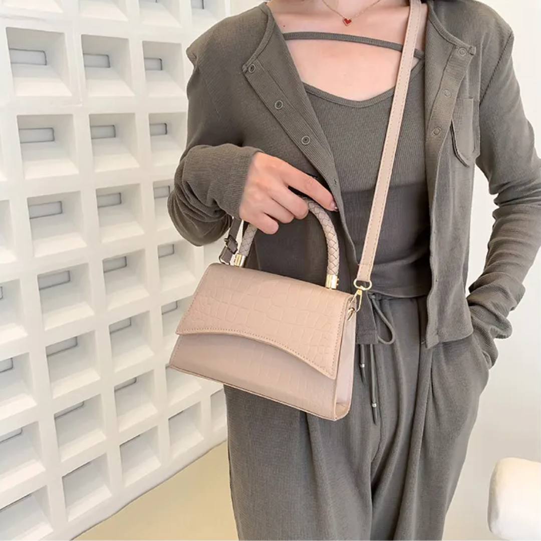 Women's PU leather handbag with top handle and crossbody strap, available in black and khaki