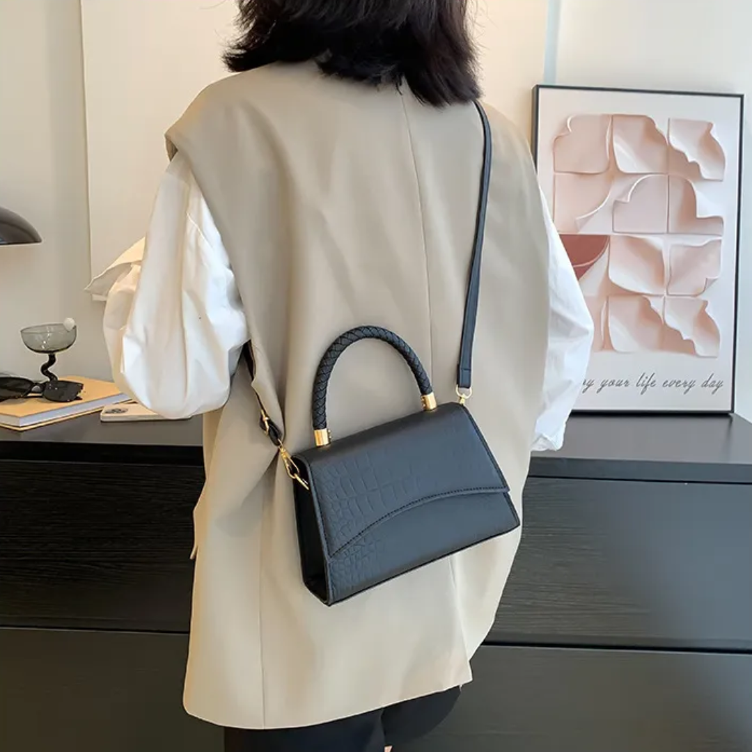 Women's PU leather handbag with top handle and crossbody strap, available in black and khaki