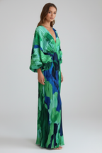 Women's long green dress with V-neckline, pleated finish and side slit