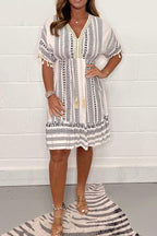 Women's boho midi dress with ethnic print, lace V-neckline and pompon sleeve details