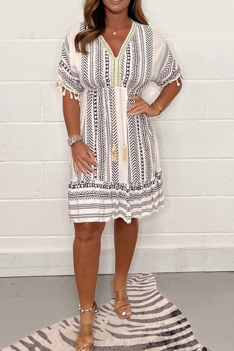 Women's boho midi dress with ethnic print, lace V-neckline and pompon sleeve details