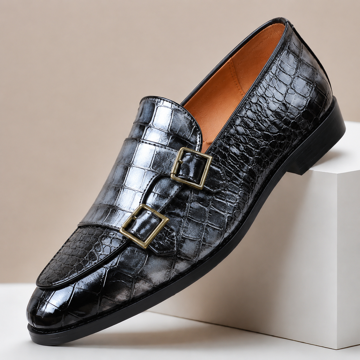 Men's leather loafers with double monk strap buckles and almond toe, crocodile-embossed finish
