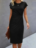 Women's midi dress with flattering silhouette and round neckline, available in 9 colours