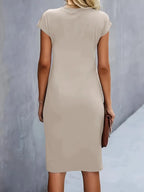 Women's midi dress with flattering silhouette and round neckline, available in 9 colours