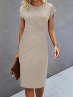Women's midi dress with flattering silhouette and round neckline, available in 9 colours