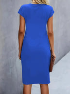 Women's midi dress with flattering silhouette and round neckline, available in 9 colours