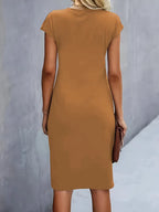Women's midi dress with flattering silhouette and round neckline, available in 9 colours