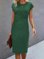 Women's midi dress with flattering silhouette and round neckline, available in 9 colours