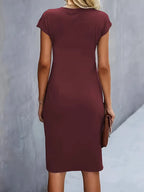 Women's midi dress with flattering silhouette and round neckline, available in 9 colours