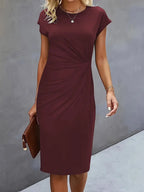 Women's midi dress with flattering silhouette and round neckline, available in 9 colours