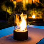 Decorative ethanol oil lamp with metal frame, glass cylinder, and decorative stones, indoor and outdoor