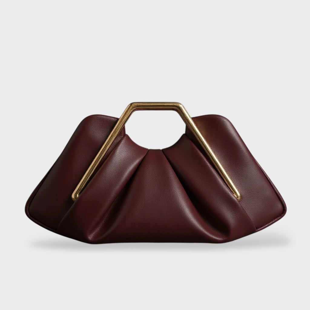 Clutch bag with origami folds and polished gold hexagonal handle in microfiber leather