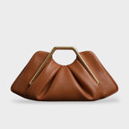 Clutch bag with origami folds and polished gold hexagonal handle in microfiber leather