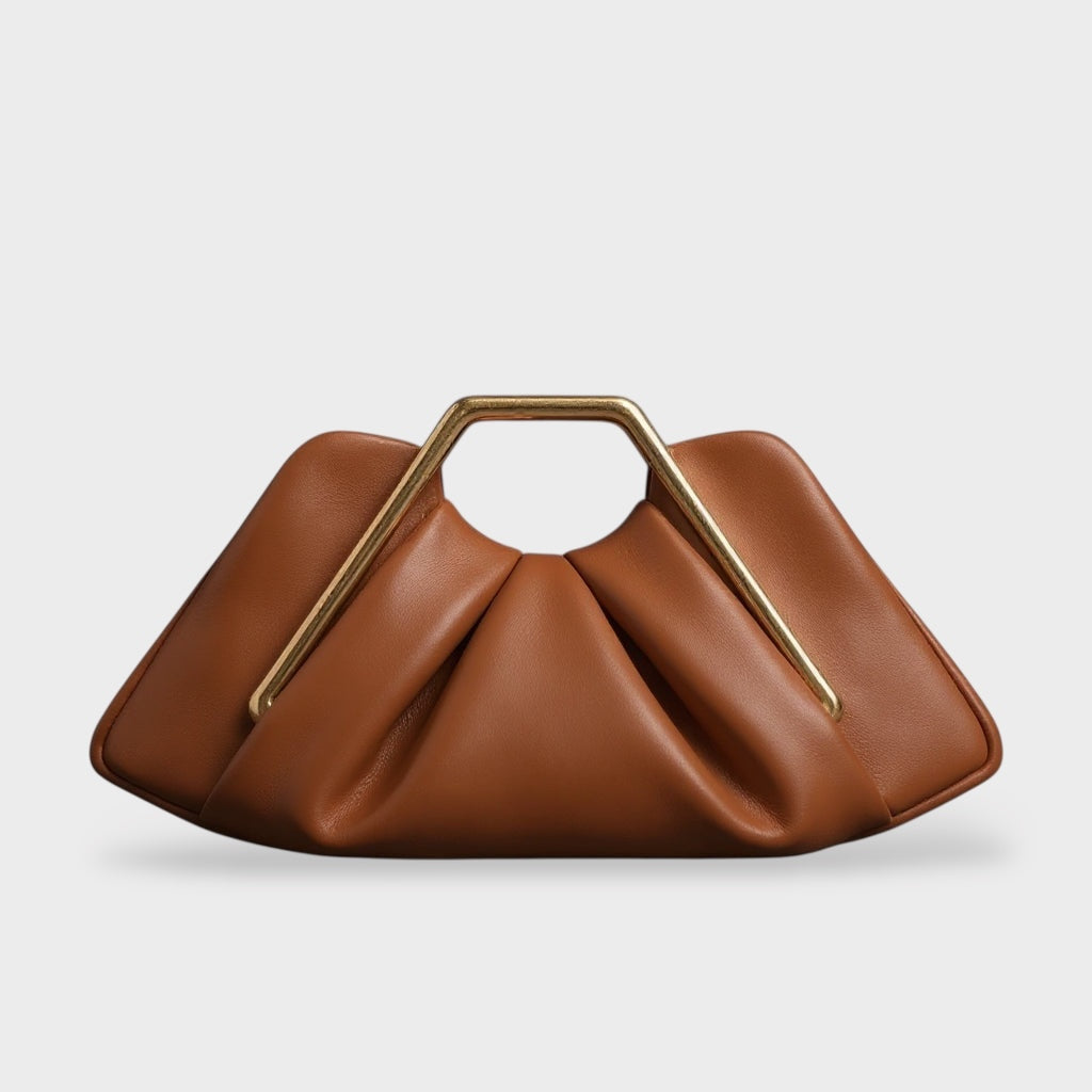 Clutch bag with origami folds and polished gold hexagonal handle in microfiber leather