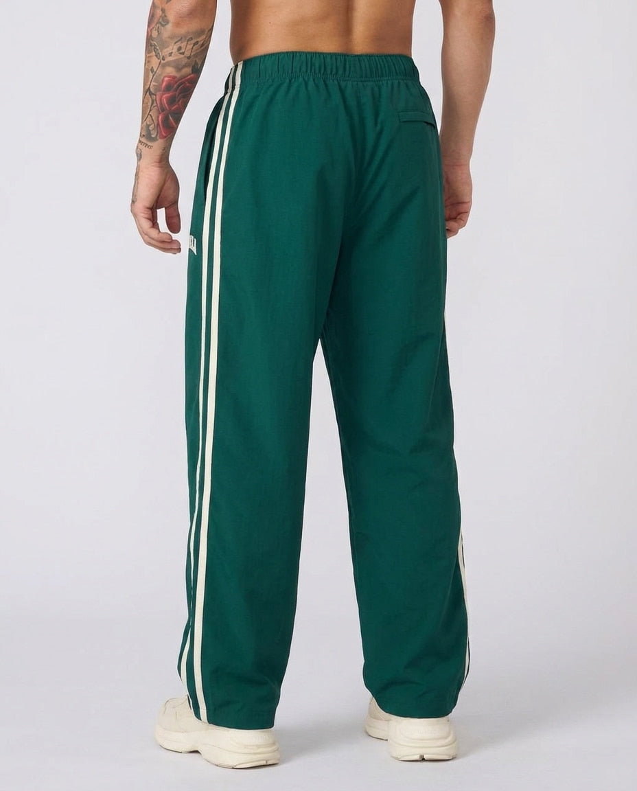 Men's striped track pants with elastic waist and zip pockets, athletic fit