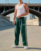 Men's striped track pants with elastic waist and zip pockets, athletic fit