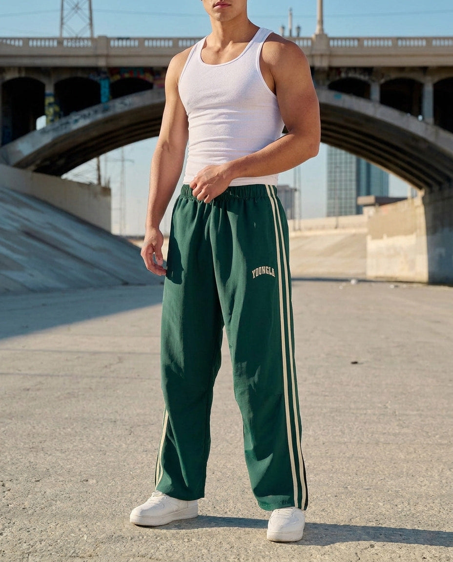 Men's striped track pants with elastic waist and zip pockets, athletic fit