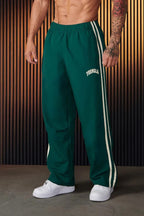 Men's striped track pants with elastic waist and zip pockets, athletic fit