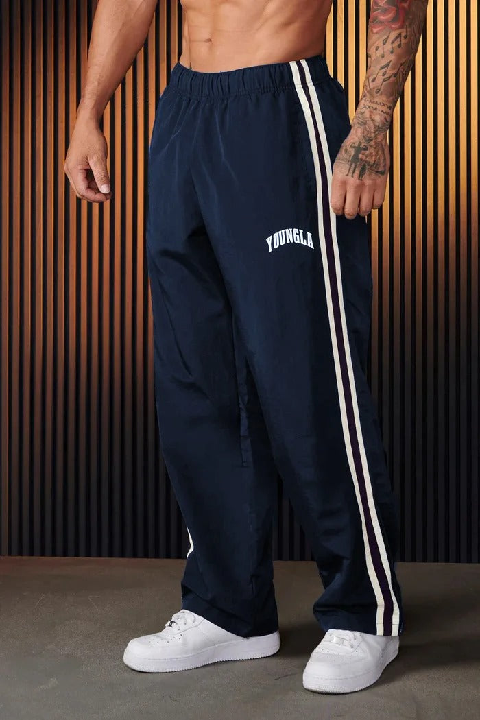 Men's striped track pants with elastic waist and zip pockets, athletic fit