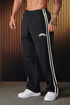 Men's striped track pants with elastic waist and zip pockets, athletic fit