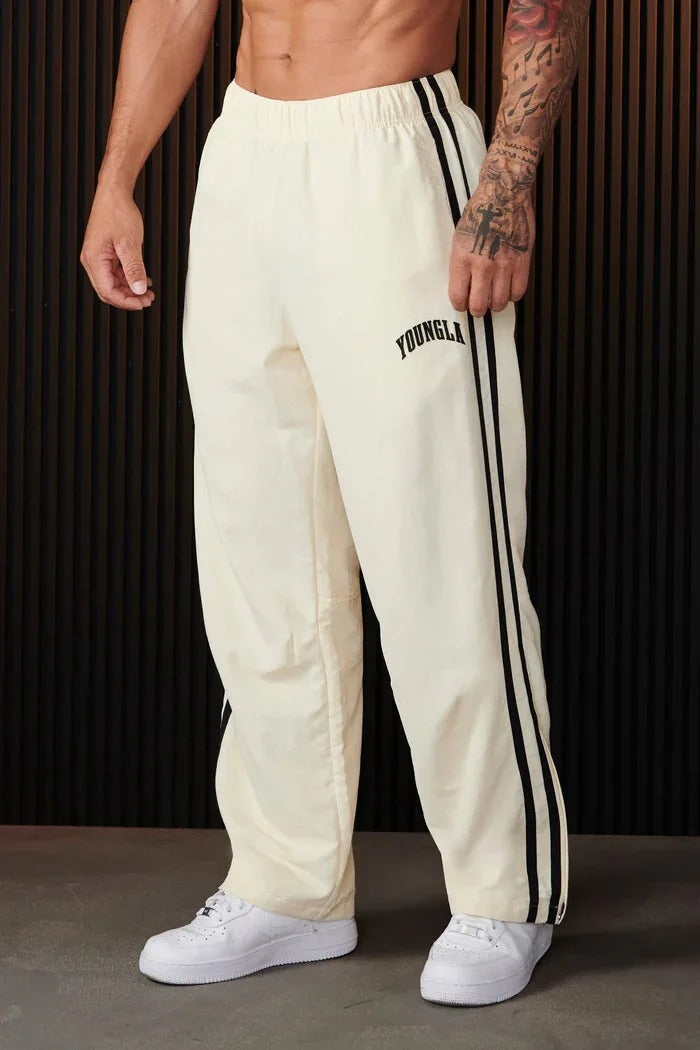 Men's striped track pants with elastic waist and zip pockets, athletic fit
