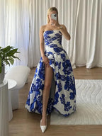 Blue strapless floral maxi dress with A-line silhouette and high leg slit