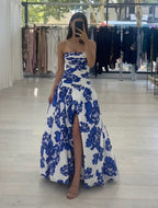 Blue strapless floral maxi dress with A-line silhouette and high leg slit