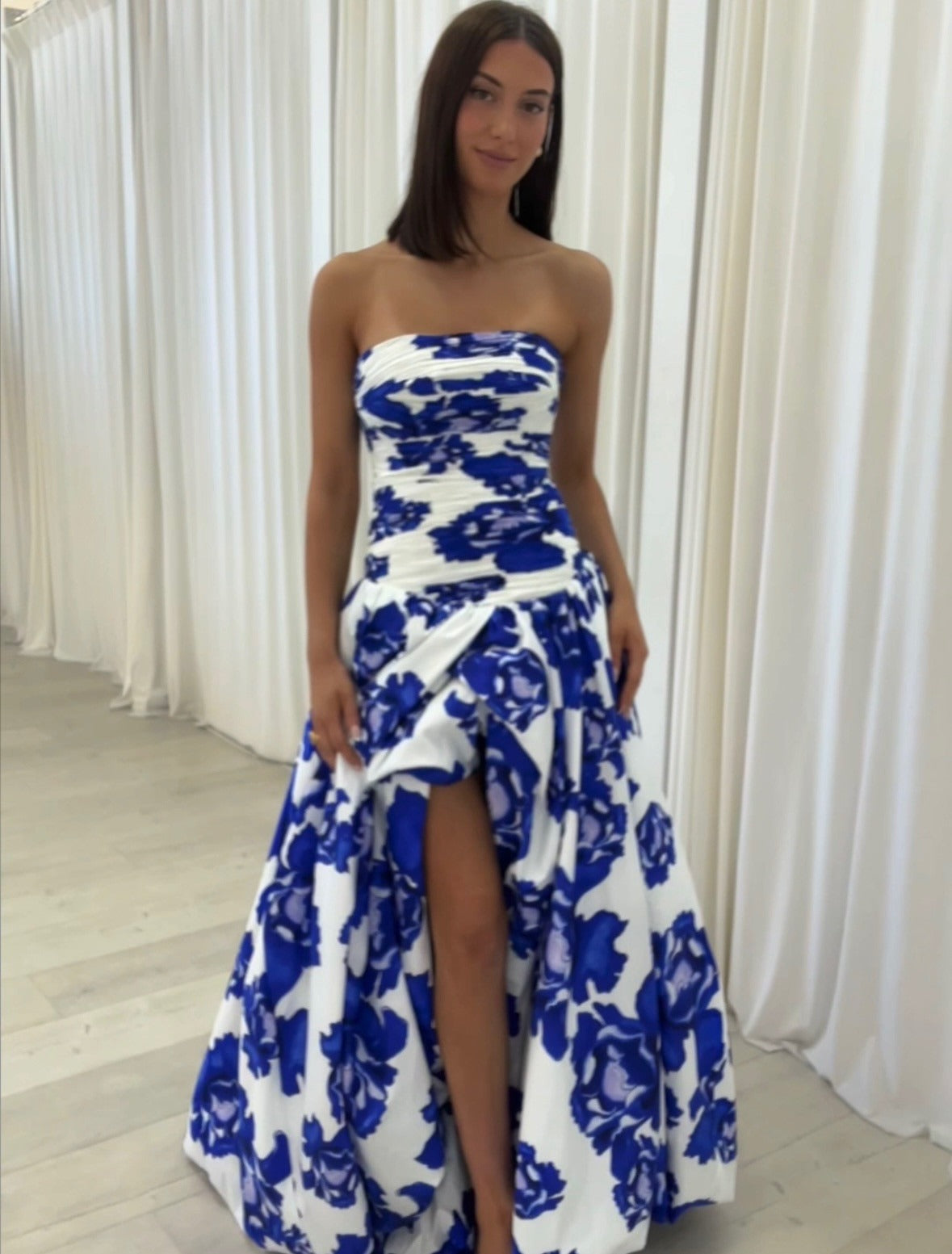 Blue strapless floral maxi dress with A-line silhouette and high leg slit