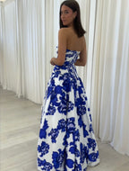 Blue strapless floral maxi dress with A-line silhouette and high leg slit