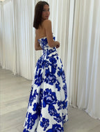 Blue strapless floral maxi dress with A-line silhouette and high leg slit