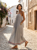 Women's striped maxi dress with spaghetti straps and red trim detail