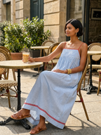 Women's striped maxi dress with spaghetti straps and red trim detail
