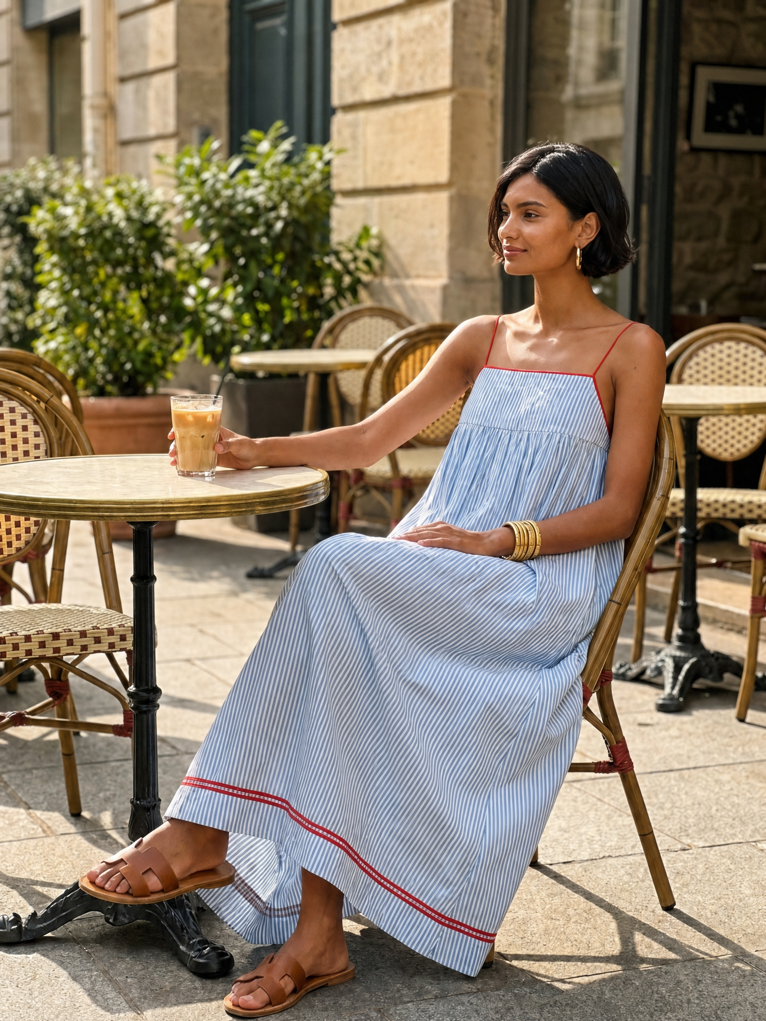 Women's striped maxi dress with spaghetti straps and red trim detail