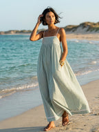 Women's striped maxi dress with spaghetti straps and red trim detail