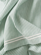 Women's striped maxi dress with spaghetti straps and red trim detail