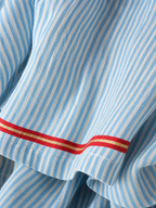 Women's striped maxi dress with spaghetti straps and red trim detail